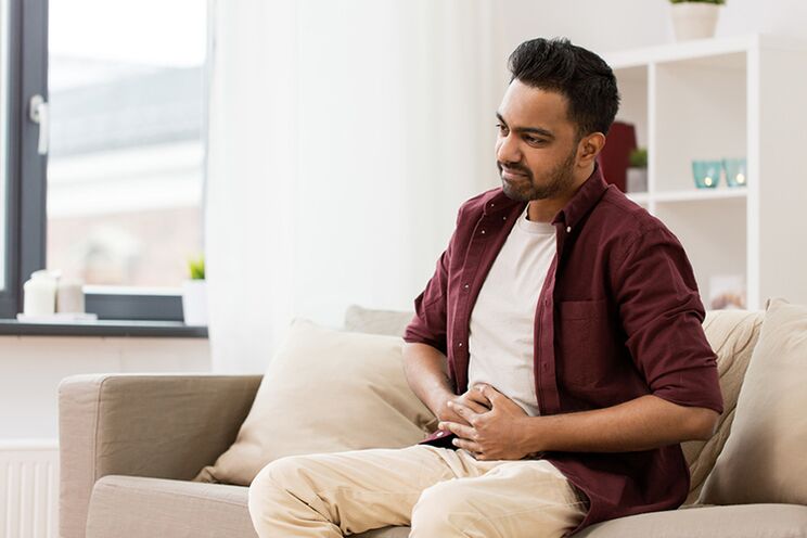 A man experiences the first symptoms of prostatitis.